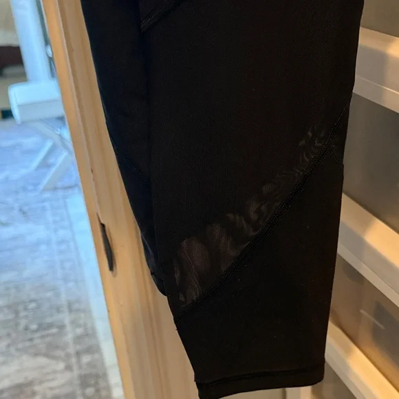 Athleta Black salutation stash pocket mesh panel. 7/8 Leggings - Picture 6 of 6